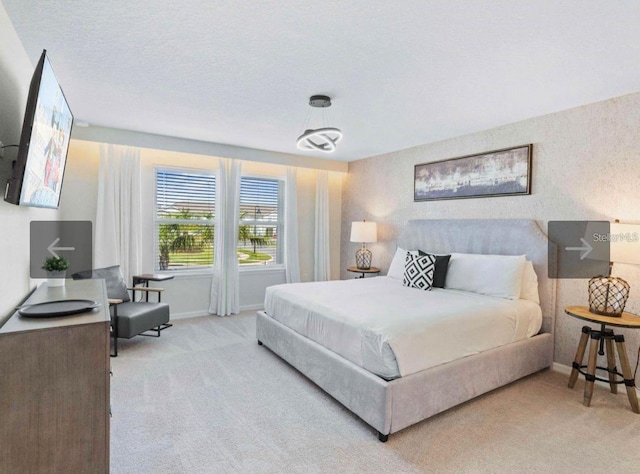 carpeted bedroom with a textured ceiling