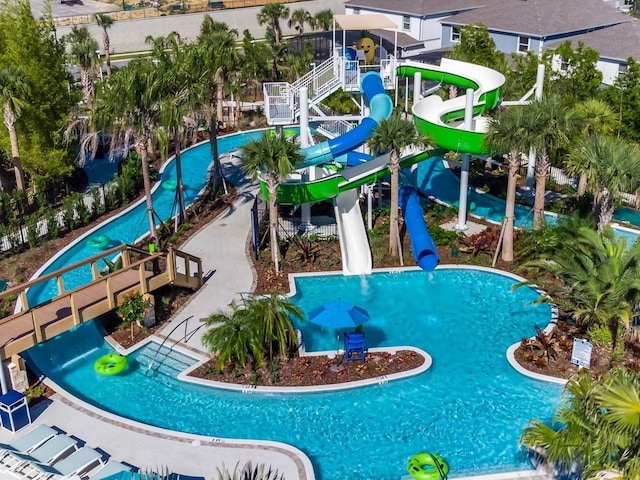 view of pool with a playground