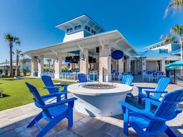 view of patio with a fire pit