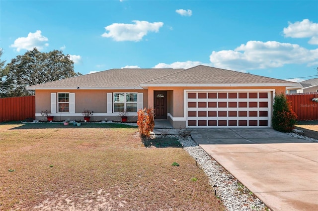 ranch-style house featuring a garage and a front yard