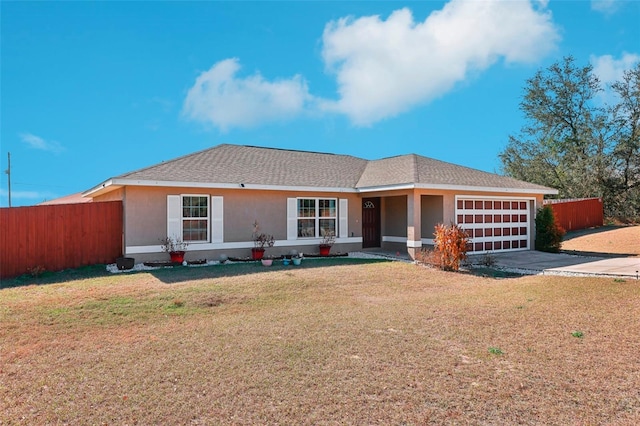 ranch-style home with a garage and a front yard