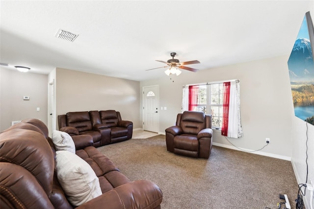 carpeted living room featuring ceiling fan