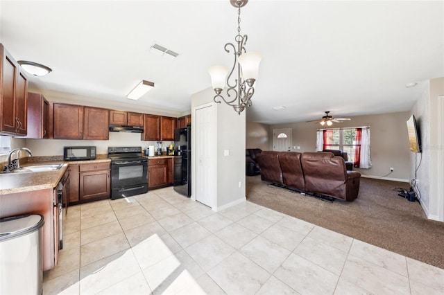 kitchen with sink, ceiling fan, hanging light fixtures, black appliances, and light colored carpet