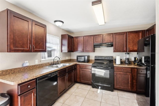 kitchen featuring sink, black appliances, and light tile patterned flooring