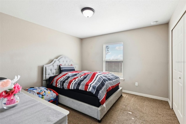 carpeted bedroom with a closet