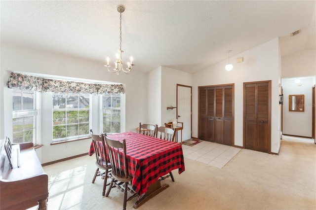 carpeted dining space featuring an inviting chandelier, lofted ceiling, and a textured ceiling