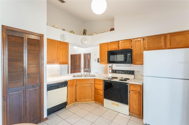 kitchen featuring sink, white appliances, high vaulted ceiling, and light tile patterned floors