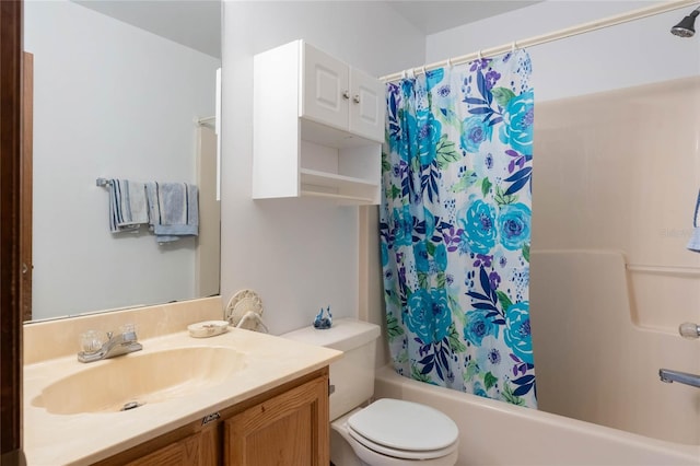 full bathroom featuring shower / bath combination with curtain, vanity, and toilet