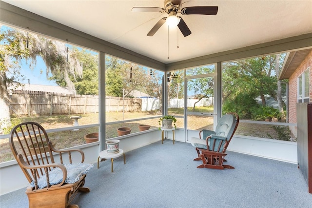 sunroom featuring plenty of natural light and ceiling fan