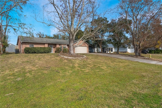 ranch-style house with a garage and a front lawn