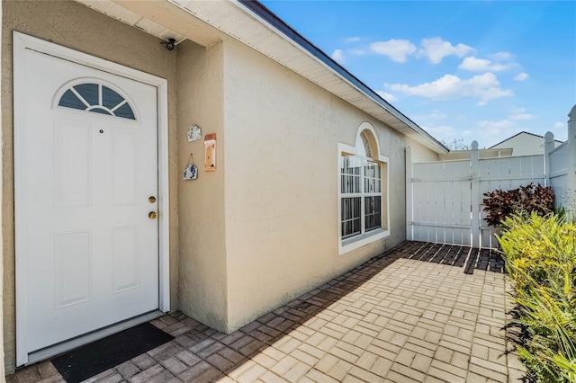 property entrance with a patio