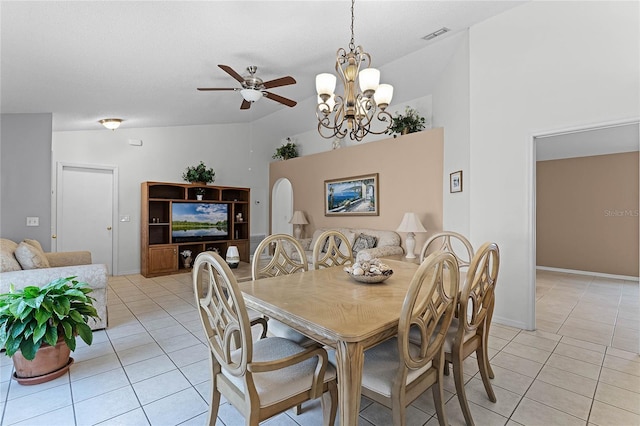 dining room with ceiling fan with notable chandelier, high vaulted ceiling, and light tile patterned flooring