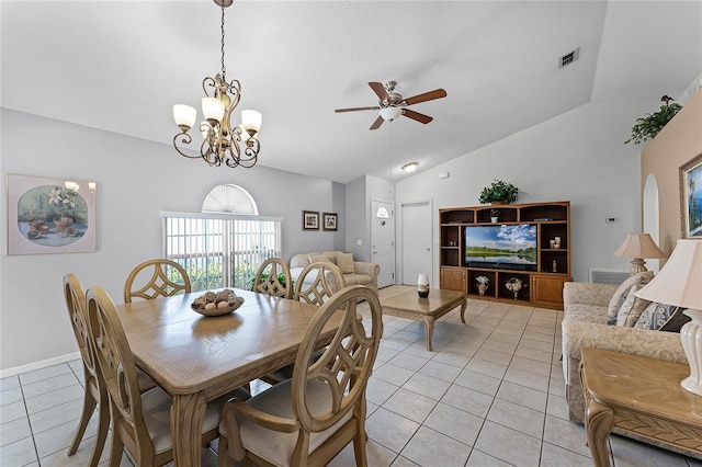 dining room with lofted ceiling, light tile patterned floors, and ceiling fan