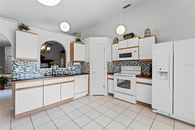 kitchen featuring white cabinetry, sink, pendant lighting, and white appliances