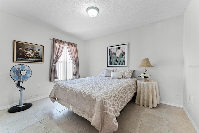 tiled bedroom with a textured ceiling