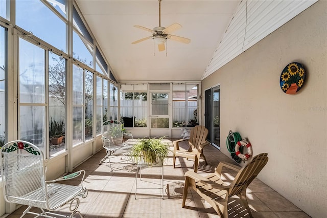 sunroom featuring vaulted ceiling and ceiling fan