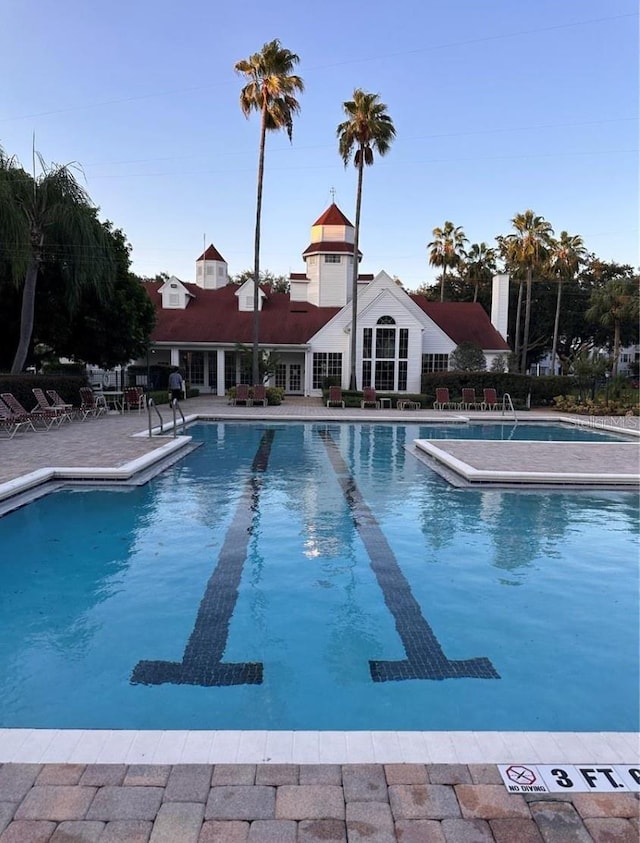 view of swimming pool with a patio