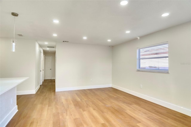 unfurnished room featuring light wood-type flooring