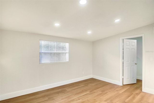 spare room featuring light wood-type flooring