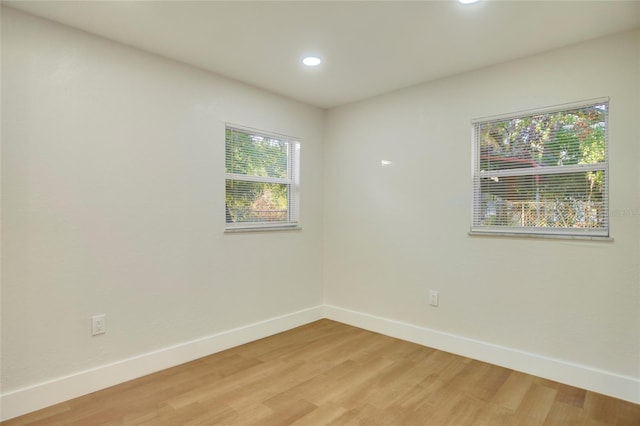 spare room featuring hardwood / wood-style flooring