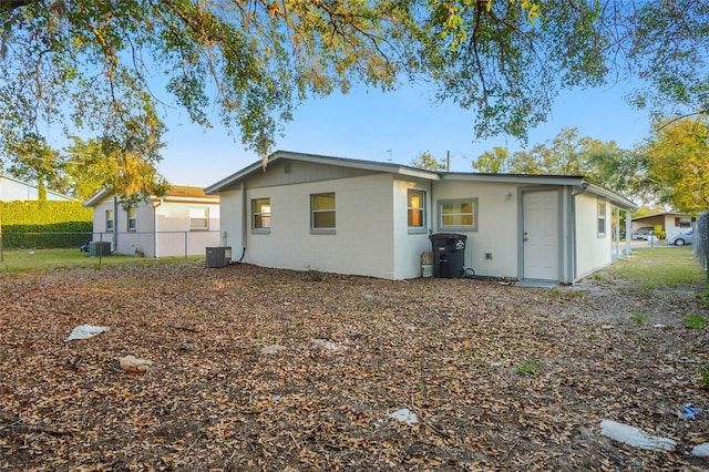 back of property featuring central air condition unit