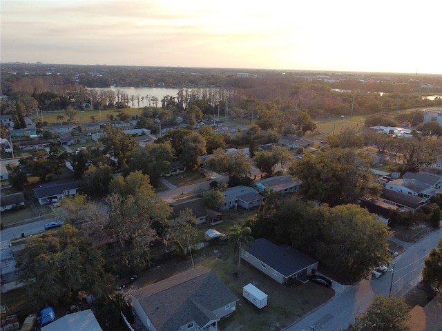 aerial view at dusk with a water view