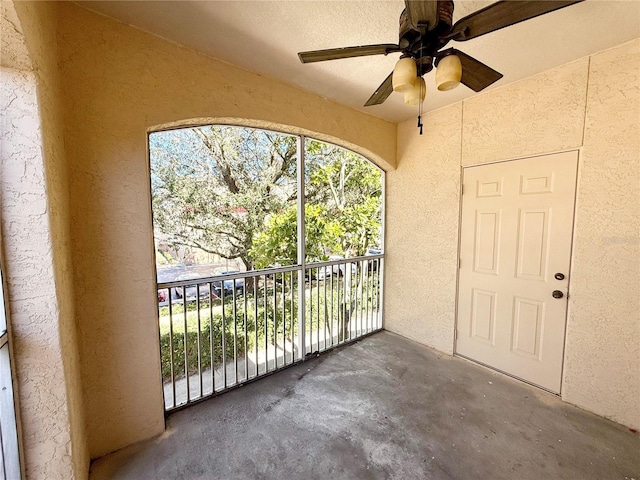 exterior space with ceiling fan