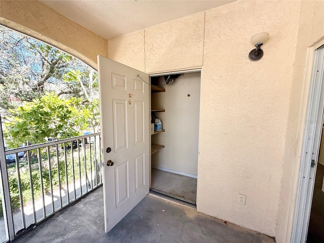 entrance to property with a balcony