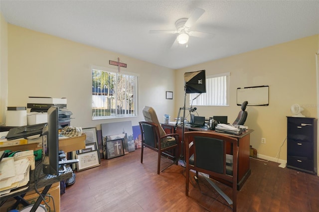 office area featuring ceiling fan, dark hardwood / wood-style flooring, and a textured ceiling