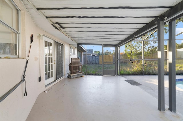 unfurnished sunroom featuring plenty of natural light