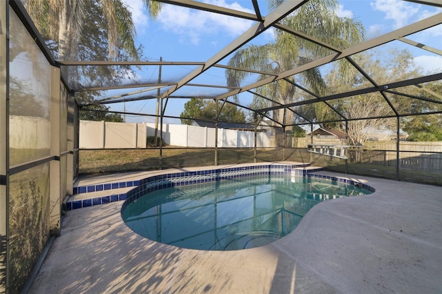 view of pool featuring a lanai and a patio