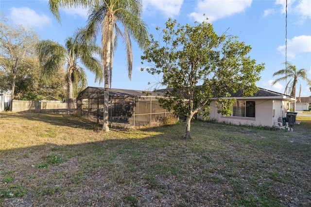 view of yard with a lanai