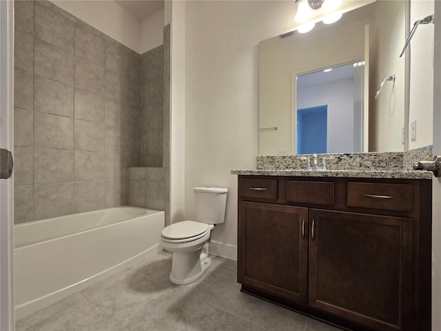 full bathroom with baseboards, toilet, tile patterned flooring, vanity, and shower / washtub combination