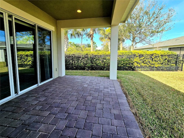 view of patio featuring fence