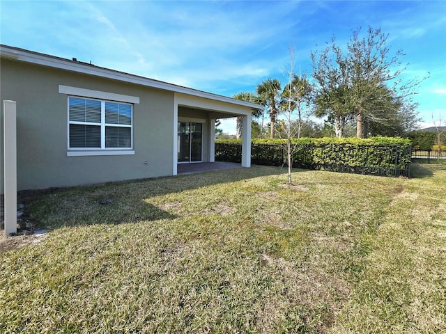 view of yard featuring a patio area and fence