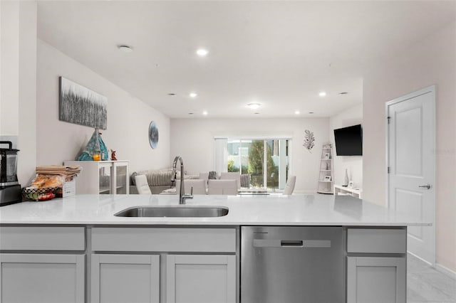 kitchen with dishwasher, sink, kitchen peninsula, and gray cabinetry