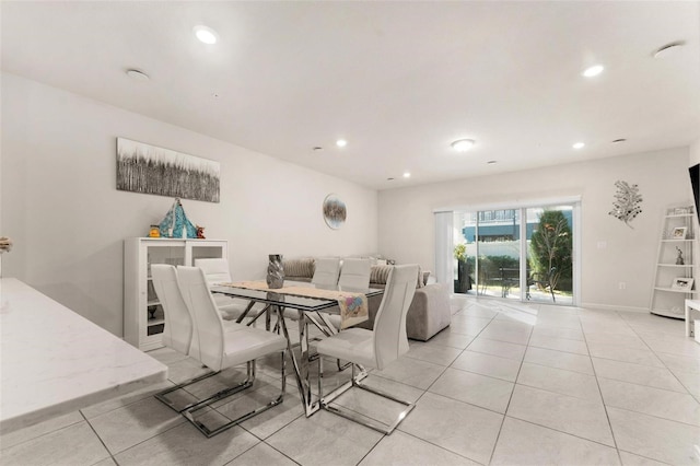 dining area with light tile patterned floors