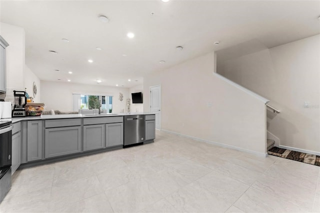 kitchen featuring gray cabinetry, sink, and stainless steel appliances