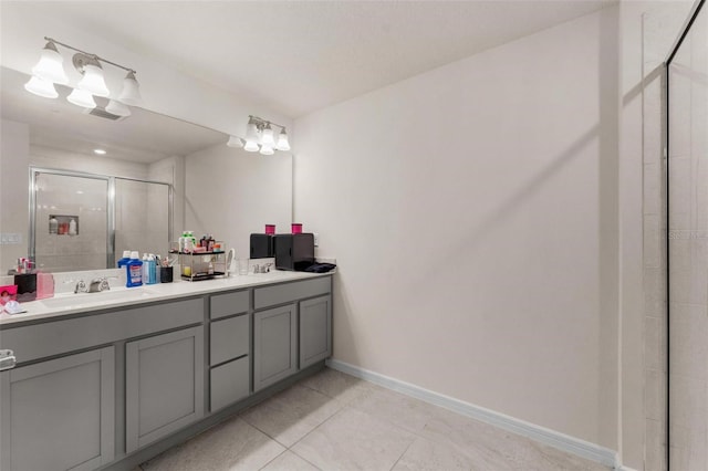 bathroom featuring vanity, an enclosed shower, and tile patterned floors