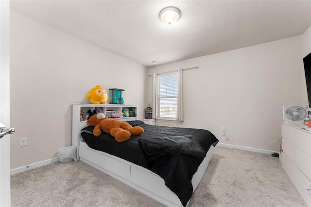 carpeted bedroom with a textured ceiling