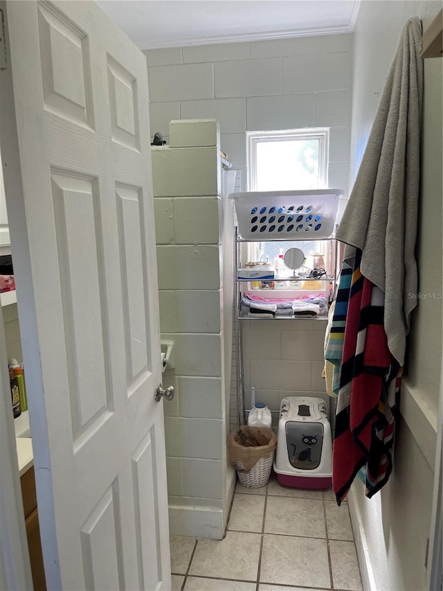 bathroom with tile patterned floors and vanity