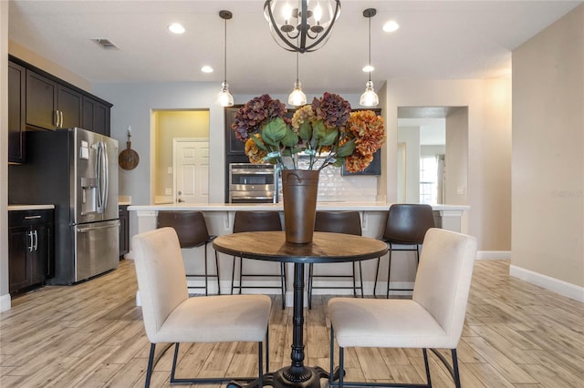 dining room featuring light wood-type flooring