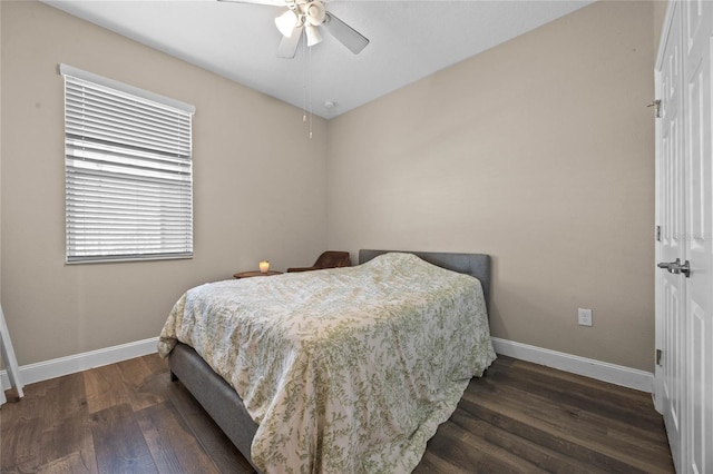 bedroom with dark wood-type flooring and ceiling fan