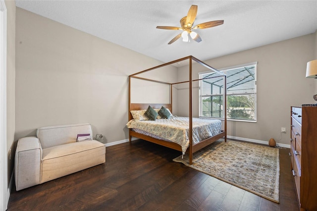 bedroom featuring dark hardwood / wood-style floors and ceiling fan