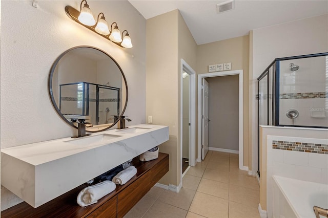 bathroom with plus walk in shower, tile patterned floors, and vanity