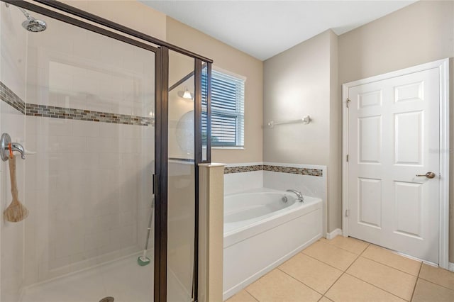 bathroom featuring separate shower and tub and tile patterned floors