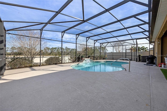 view of pool featuring a lanai and a patio