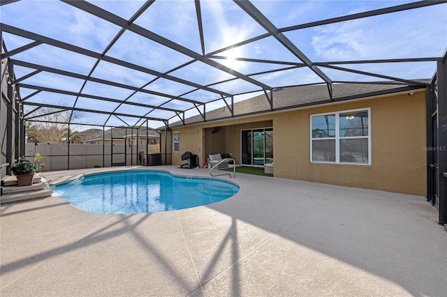 view of swimming pool with a lanai and a patio