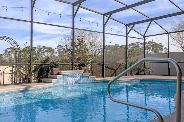 view of pool featuring pool water feature and glass enclosure