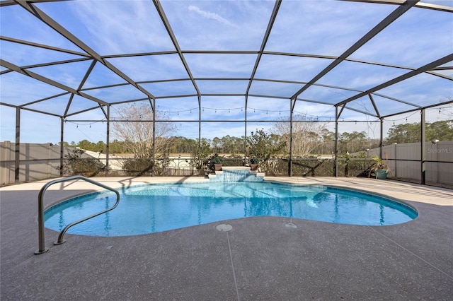 view of swimming pool with a lanai and a patio